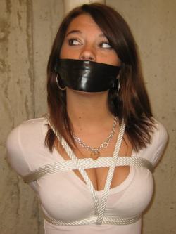 tiedgirlsarethebest:  baloun70:  xatomix89:  auctionhouse69:  johnnyadidas:  (via simplybondage, racemason-deactivated20100820-d)  (via johnnyadidas) She strains to here the negotiations. White slavery? It’s real? Maybe if she can convince her new owner