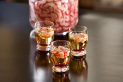 nerdylolita:  zombie-wonderland:  Channel your inner mad scientist with this Bloody Brain Shooter. Add chilled vodka and lime juice to a shot glass, then use a straw to drip Irish cream into the glass. The acidic lime juice will cause the Irish cream