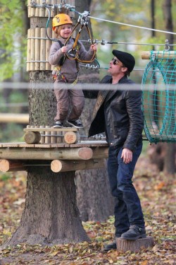 suicideblonde:  Brad Pitt with Shiloh at a park in Budapest today This is the BEST PARK EVER.  A zipline? YES PLS.  