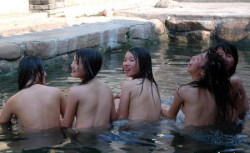 soakingspirit:  soakingspirit:  Young women of Zhuang ethinic group bathe in an open-air hot spring in Nanxiang Town in Hezhou, Southwest China’s Guangxi Zhuang Autonomous Region. There are three hot springs in the mountain town and local Zhuang people