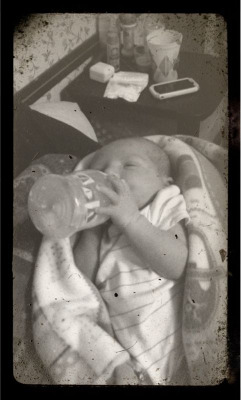A week old and he can hold his own bottle, I love my little one!!