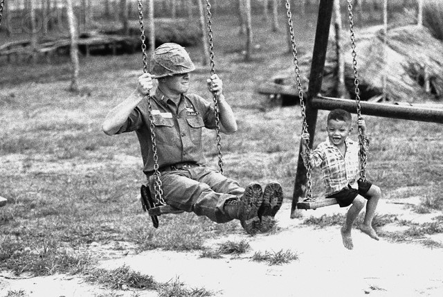 mluce:  A young Vietnamese child and a U.S. soldier of the 25th infantry division
