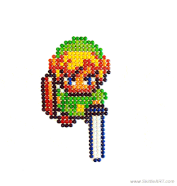 ianbrooks:  Skittle Link Attack by Matt McManis Artists’ comments: “An animation of Link, from The Legend of Zelda, made out of real Skittles. I photographed it frame by frame. The animation took 7 frames and 4 hours to lay out, Skittle by Skittle.”