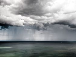 nationalgeographicmagazine:  Sailboat at Sea, GermanyPhotograph by Patrick LieninWhile hiking at Jasmund National Park in northwest Germany, a rainstorm passed by and created a stunning scene! The sea was completely flat and the only thing out there was