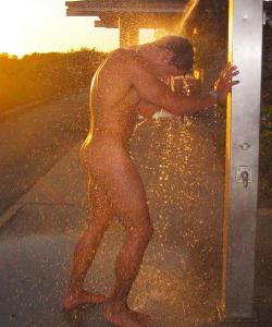 aussielicious:  jocklicious:  (via About Zentai, Spandex Rubber, Leather and more)  Bring back summer! A cooling shower out in the setting sun after a beautiful day nude on the beach! 