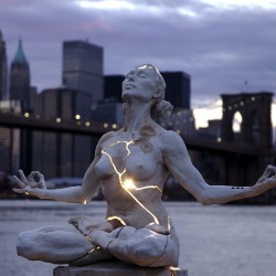  poorartists:  Paige Bradley created one of the most striking sculptures I’ve seen in recent times. Her masterpiece, entitled Expansion, is a beautiful woman seeking inner piece but fractured and bleeding with light. “From the moment we are born,
