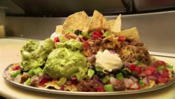 oscarthegrouser:  Mount Nachismo5lb nacho platter.  I think nachos are by far my favourite food group