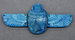 elhieroglyph:  Ancient Egyptian scarab amulet with wings Ancient Egyptian scarab amulet with wings made from faience, blue glazed. Late Period (664 - 332 BCE). Amulets were often placed on the chest or over the heart of a mummy to help on the journey
