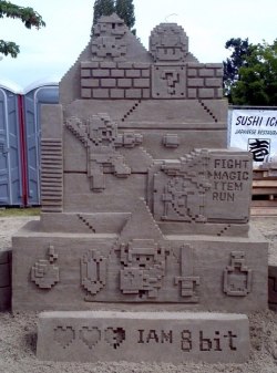 albotas:  8-bit Sand Sculpture: Why can’t your kids make shit this cool? Look at this amazing sand sculpture. Now look at the uninspired pile of ass that your offspring shat out of a cheap castle-shaped bucket and proudly shows off during family vacations