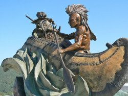 Bronze Sculpture of Native American and Fur Trapper outside of