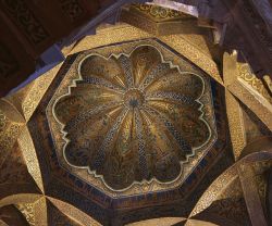 r-colored:  The ceiling of the mihrab at the Mezquita-Catedral, also known as the Great Mosque-Cathedral of Córdoba. Andalusia, Spain. The original building was erected over the site of an old Visigothic church by Umayyad Caliphate after it was overthrown