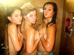 sexncomics:  lesbianwomen:  Three lesbian sluts taking a shower together, covering their breasts  !
