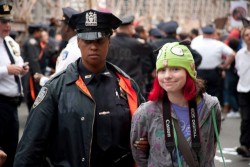 laughingalonewithyaoi:  wowwhatitype:  danceswithfaeriesunderthemoon:  stuish:  cheguevaraslovechild:  The Smile of Hope This is a picture of a little 13-year-old girl arrested during the ‘Occupy Wall Street’ protest on the Brooklyn Bridge. The picture