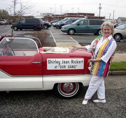 Wearing a colorful vest of her own creation, 79 year-old Shirley Jean Rickert (Measures) poses next to the vintage car that&rsquo;ll transport her along the Atlantic City boardwalk, in a 2005 &lsquo;Sons of the Desert&rsquo; reunion parade.. Before she