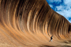 inothernews:  CLIFFS OF NOTE   A multi-coloured granite  formation near Hyden, Western Australia, known as Wave Rock, towers 47 feet high and 350 feet long.  (Photo: Ilya Genkin / Solent News via the Telegraph) 