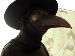 10knotes:  life-of-a-monster:  During the Bubonic Plague, doctors wore these bird-like masks to avoid becoming sick. They would fill the beaks with spices and rose petals, so they wouldn’t have to smell the rotting bodies.  A theory during the Bubonic