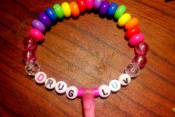 &ldquo;Drug Luv&rdquo; rainbow kandi I made for Nocturnal. It has a pink dolphin, but you can barely see it :/