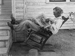 Farmer reading his farm paper photo by George W. Ackerman, 1931