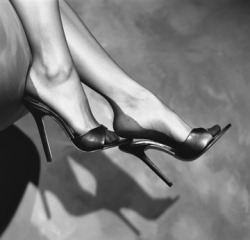 submissivegent:  Whether they admit it or not, I think all men have a some sort of foot and shoe fetish. This woman’s are perfect and the seamed stockings are the final hypnotic touch. 