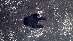 Abandoned rocker glove in the parking lot.