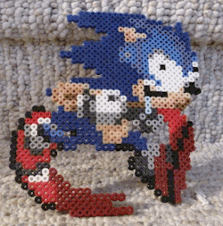 epicpixel:  I have brought Dumb Running Sonic into the realm of physical reality with perler beads!  I love Dumb Running Sonic! http://epicpixel.tumblr.com/ REBLOGGED because the first one wasn’t working right.  omg, he&rsquo;s drooling too.