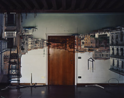 theclotheshorse:  Camera Obscure with Abelardo Morell; he covered all his windows with black plastic in order to achieve total darkness, he then cut a small hole in the same black plastic material, an image of the outside scenery was reflected directly