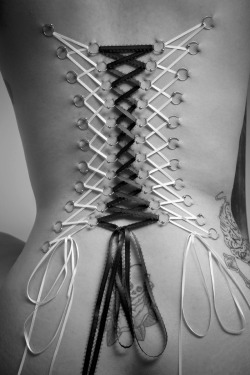 fawnstarflare:  serendipityslave:  mirellamel:  hey bella7 :))) Kisses  sexy corset piercings   You will always be corseted. This corset Will not reduce you waist or belly, but you will ever fear snagging your lacings on something