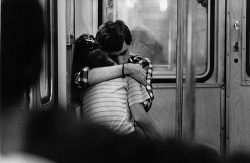 yesdarlingido:  Subway. Buenos Aires (by Daniel Merle) “In transit. I saw them. Just two kids in love. I got my 135 mm and made one shot” 