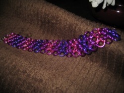 geekygears:  Chainmail bracelets I wove last night. It’s &frac34;ths of an inch wide and the other is &frac12; an inch and the rings are anodized aluminum. I wanted to try a color gradient and I like how it came out. The other was commissioned by