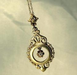 awesomeantiquities:  This necklace is crafted from 14ct yellow gold. The pendant features a diamond in the centre. It is believed to be from the Victorian era. This isn’t one of my favourites but I find the filigree work around the edges beautiful.  