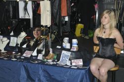kennelmaster:  wyredslave:  harbingeruk:     wyredslave:  Holly Toy at the Birmingham Bizarre Bazaar.  Holly was modelling at the Wyred Slave stall and has her hands cuffed behind as well as attached to her collar. The collar was in turn teathered so