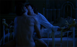 Jeremy Irons and Genevieve Bujold in Dead Ringers (1988), directed by David Cronenberg. Note the surgical tubing and clamps used for bondage.