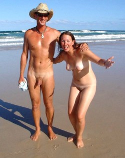 nudistlifestyle:  Nudist couple walking on the beach. 