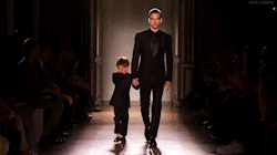 liltify:  nakeid:  theleatherlook:  smohkist:  voleum:  kisslng:   Brazilian model Alexandre Cunha was paired with a three-year-old moptop to showcase Smalto’s matching child-sized and adult tuxedos. Unfortunately, while the pressure of performing didn’t