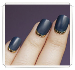 modcloth:  A gold and navy manicure via This is Glamorous. 