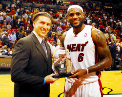 fuckyeahteamlbj:  Nick Verna, Southern Region DSM of Kia Motors America presents LeBron James of the Miani Heat with the Eastern Conference Kia Player of the Month award prior to the game against the Sacramento Kings on February 21, 2012. 