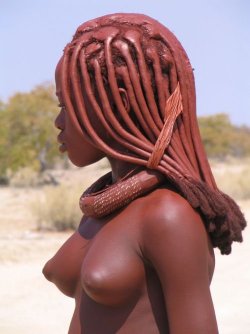 alternativez0ne:   The Himba wear little clothing, but the women are famous for covering themselves with otjize, a mixture of butter fat and ochre. The mixture gives their skins a reddish tinge. This symbolizes earth’s rich red color and the blood that