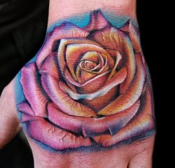fuckyeahqualitytattoos:  a proper flower/hand tattoo by Cecil Porter