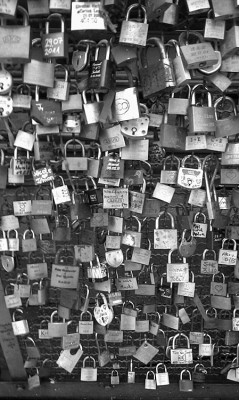 h0lybible:   “Love Locks” You and a friend carve your initials into a padlock, attach the padlock to a bridge and throw the key into the river, so that even if the friendship fades the padlock will always be there to remind you of the good times. 
