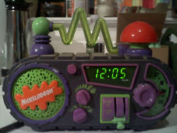haleysarah410:  my cousin had one of these. I was so jealous.  Oh god, I had this clock! It made all sorts of crazy noises and lit up and the big red button was the snooze!