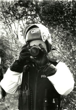 Riot police photographer.