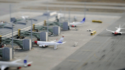 captainamerica-and-fondue:  explodingplant:  parapraxicprince:    #IT’S REAL AND LOOKS TINY BECAUSE OF THE SHORT FOCAL LENGTH    Look at that little ladder waiting for its plane.  Tilt shift is amazing ! 