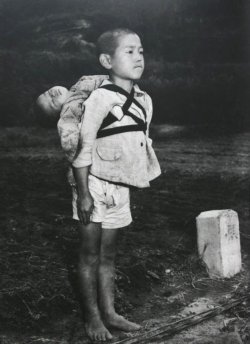  Real-life Grave of the Fireflies: (Photo) Stoic Japanese orphan, standing at attention having brought his dead younger brother to a cremation pyre, Nagasaki, by Joe O’Donnell 1945  This photograph was taken by an American photojournalist, Joe O’Donnell,