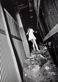 timelightbox:  Untitled (woman in white dress running), 1971 Daido Moriyama, who is featured in a new exhibition at the Los Angeles County Museum of Art, arrived in Tokyo in 1961 and began photographing the seedy streets of Shinjuku. See more here. 