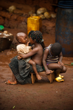 Silatjunkie:  Children Keep Each Other Company Outside Their Home In Cameroon Africa,