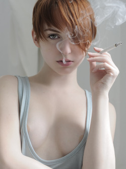 lauraunbound:  Photo By: Richard Dubois  (No, I dont smoke, I didnt take up smoking, I didnt enjoy smoking the two whole cigarettes that were needed for this shoot. However, it does look badass)  