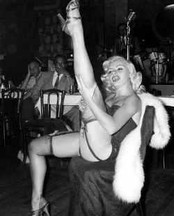 Rita Grable kicks up a shapely leg, during a performance at an unidentified 50&rsquo;s-era nightclub..