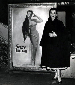 Sherry Britton    aka. &ldquo;The Sweetheart Of 52nd Street&rdquo;.. A press photo captures Ms. Britton posing alongside a painting based on one of her promotional photos..