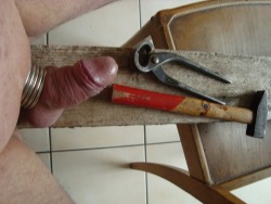 my cock nailed to a board with tools