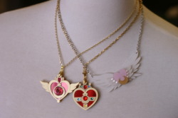 cupcakependleton:  mooneternalmakeup:  My Sailor Moon compact necklaces from Kumacrafts!  Honestly, not a single photo does any of these beauties justice.  My personal favorite is the Crisis pendant which arrived in the mail this morning;  It is SO,